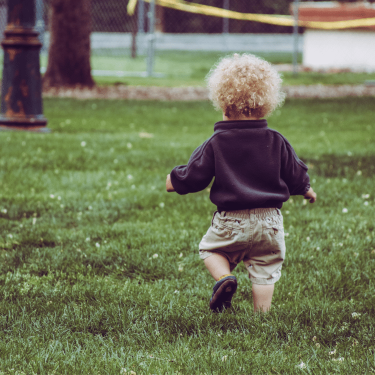 young child walking